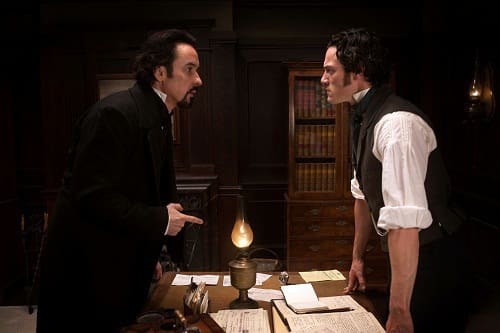 John Cusack and Luke Evans in The Raven