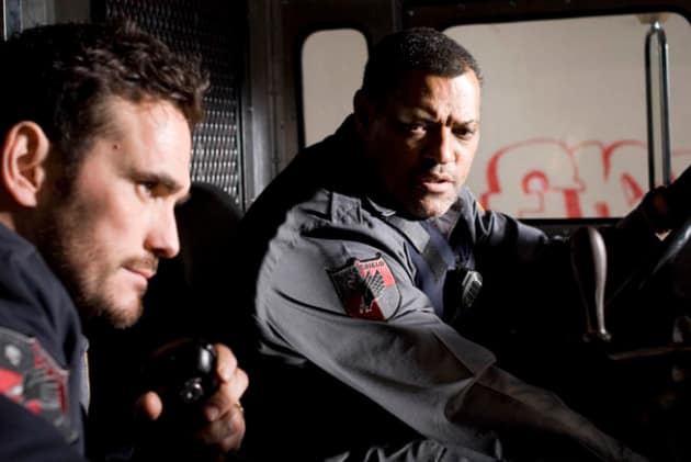 Mike and Baines listen to a call.