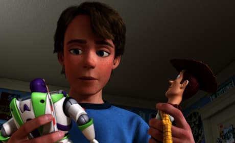 Andy Holds Woody and Buzz