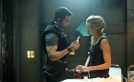 Guy Pearce and Maggie Grace in Lockout